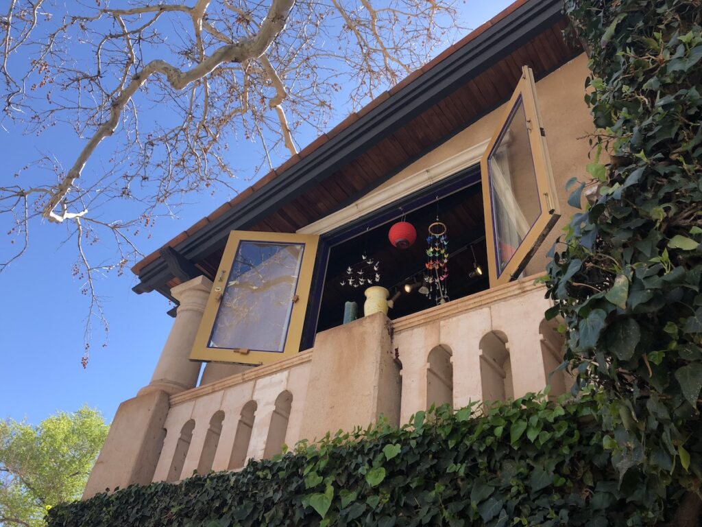 A shop window hung with wind chimes and lanterns in Tlaquepaque shopping and art village in Sedona.